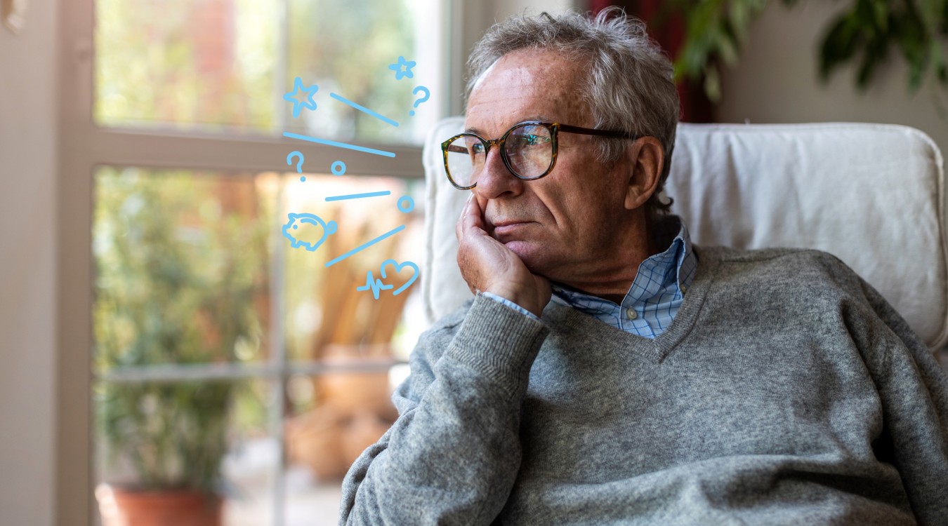 Ein Mann schaut nachdenklich aus dem Fenster